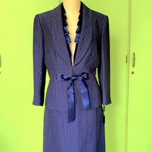 Navy blue Tahari suit with ruffle neck and shimmer thread detail. 2 piece, sz 8